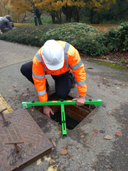 Worker using Manhole Guardian at an open manhole